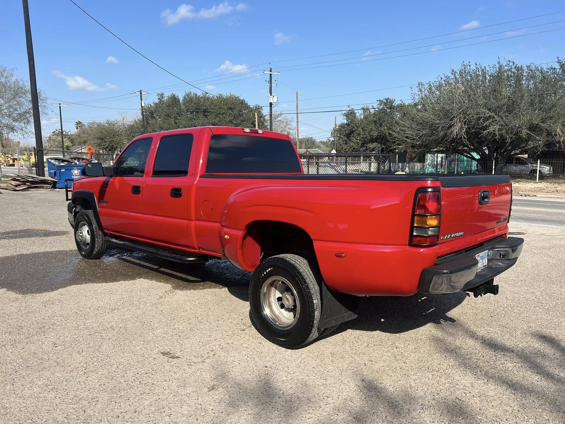 Red Chevrolet Silverado restored after rear driver-side collision repair